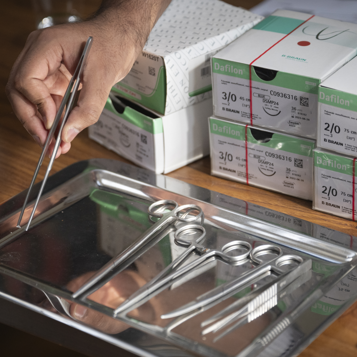 a hand and surgical tools